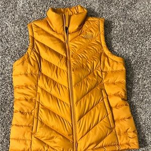 Women’s The North Face gold vest. Size medium.